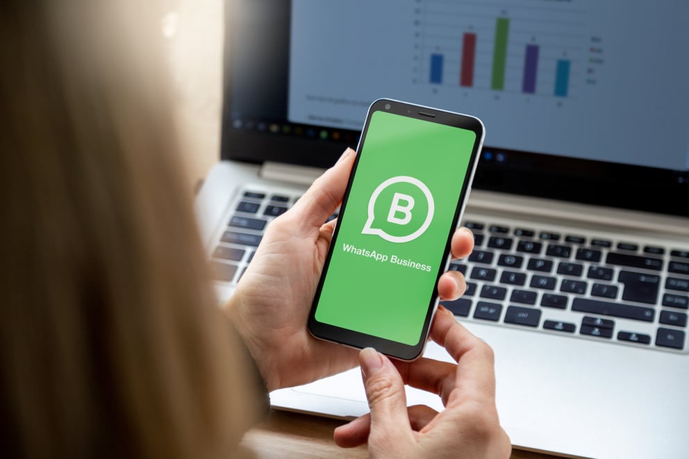 woman on WhatsApp Business on phone 